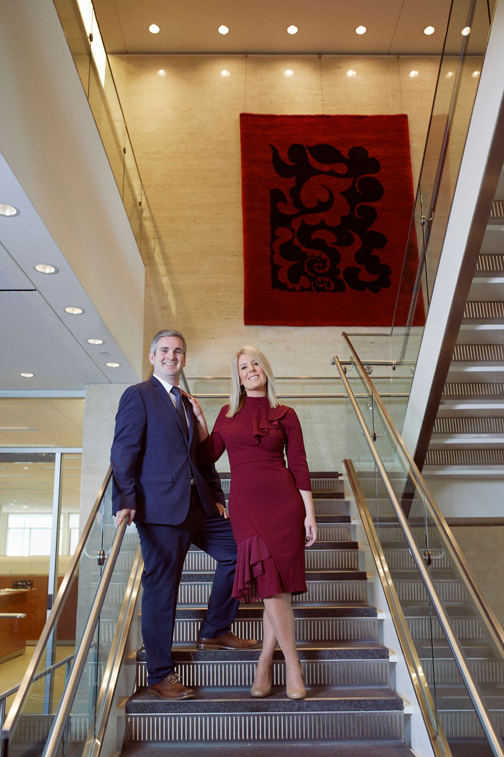 Stacy and Tyler stand in the stairwell of Central Bank’s Financial Center. Behind them is the tapestry “Volutes” by Spanish artist Pablo Picasso, 1973.